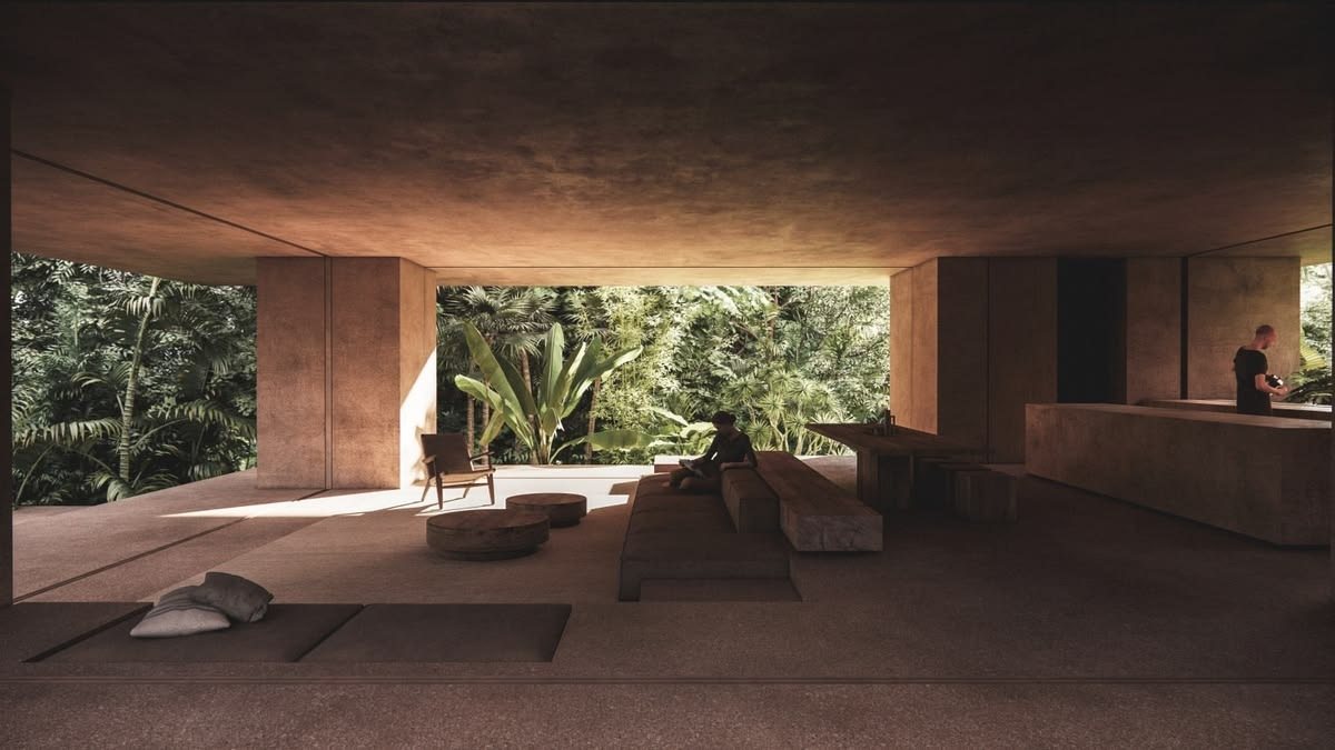 Living room of a residence opening level onto planting
